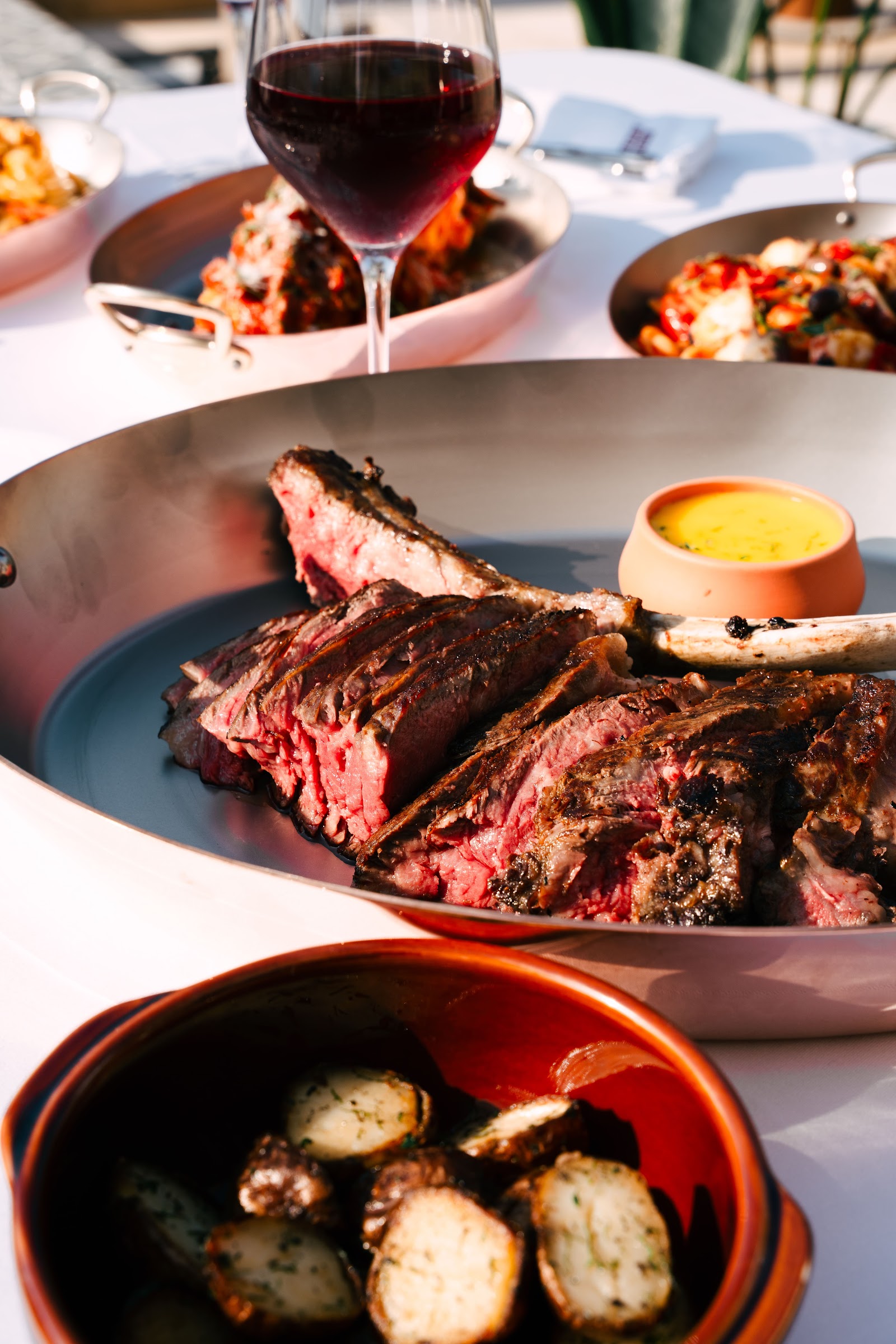 African Queen Dubai — Riviera-style terrace dining at sunset on J1 Beach