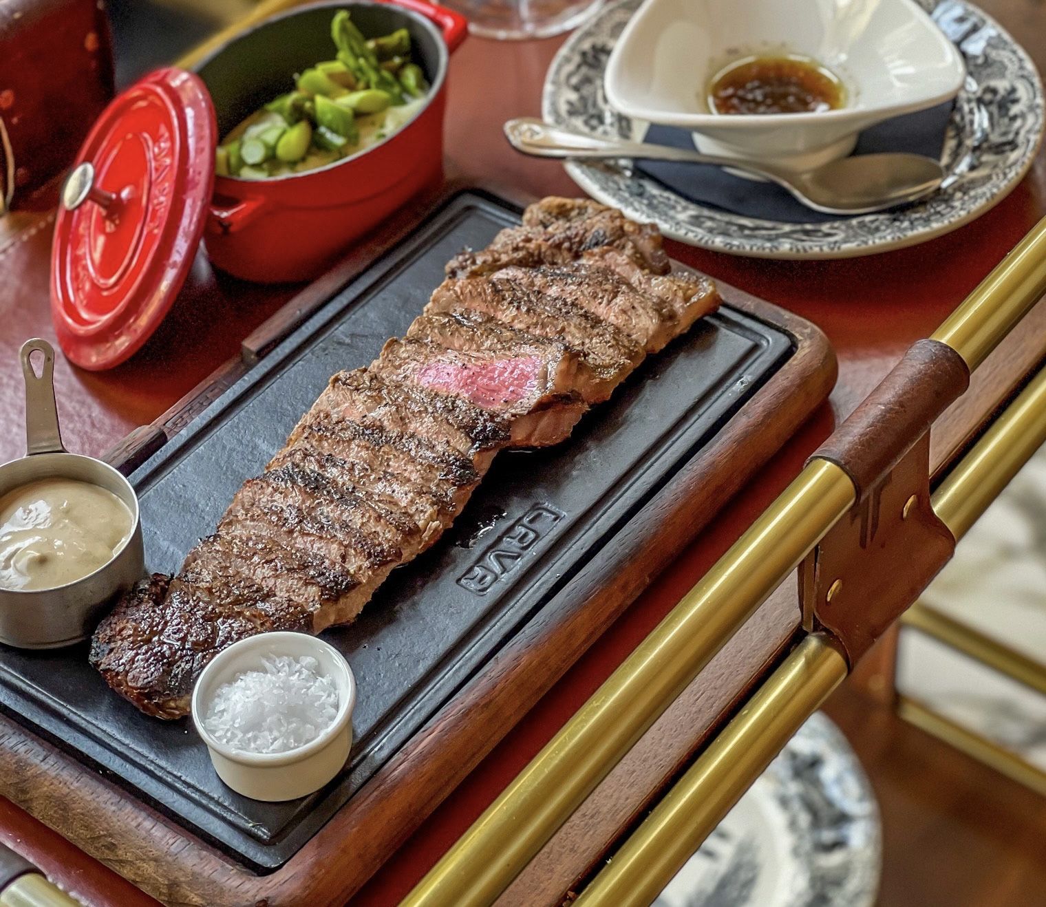 Asado Dubai Palace Downtown late service — Argentinian parrilla grill at night, smoked beef tenderloin