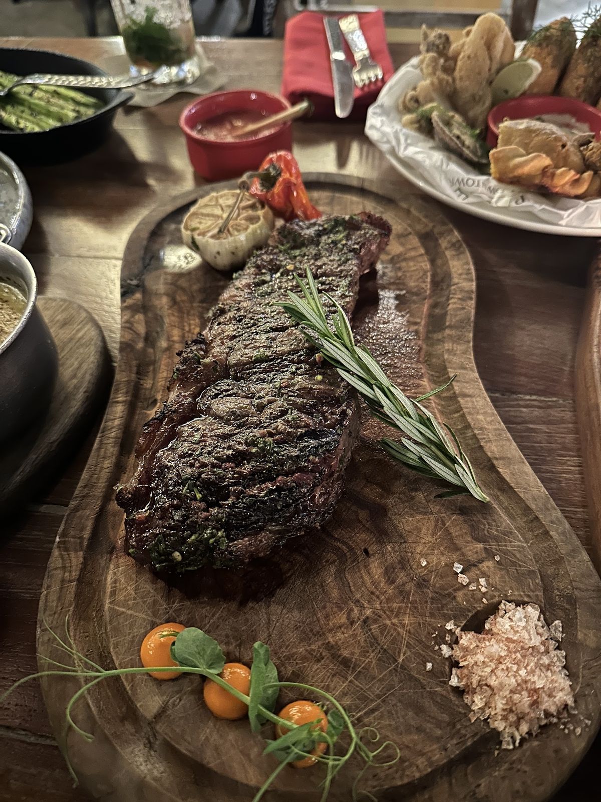 Asado Dubai — the lakeside Argentine grill terrace facing the Burj