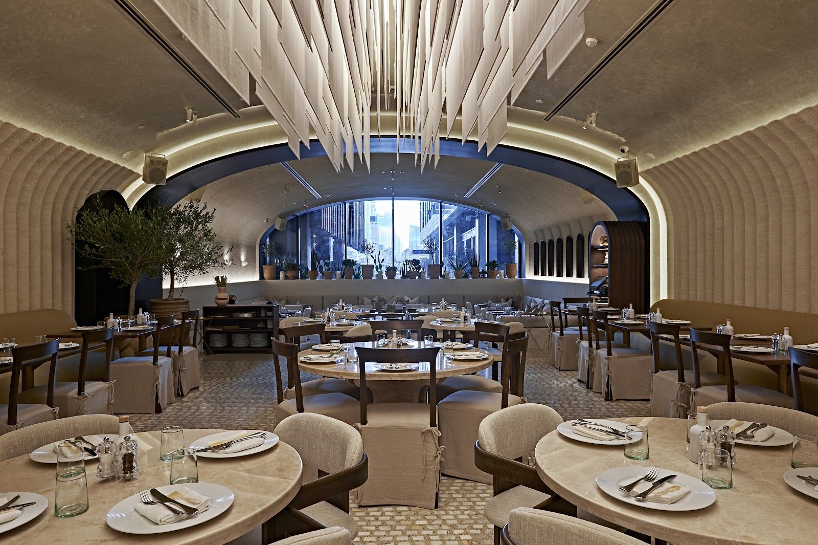 Avli by Tashas style Greek taverna interior — warm lighting and earthy tones in Dubai restaurant