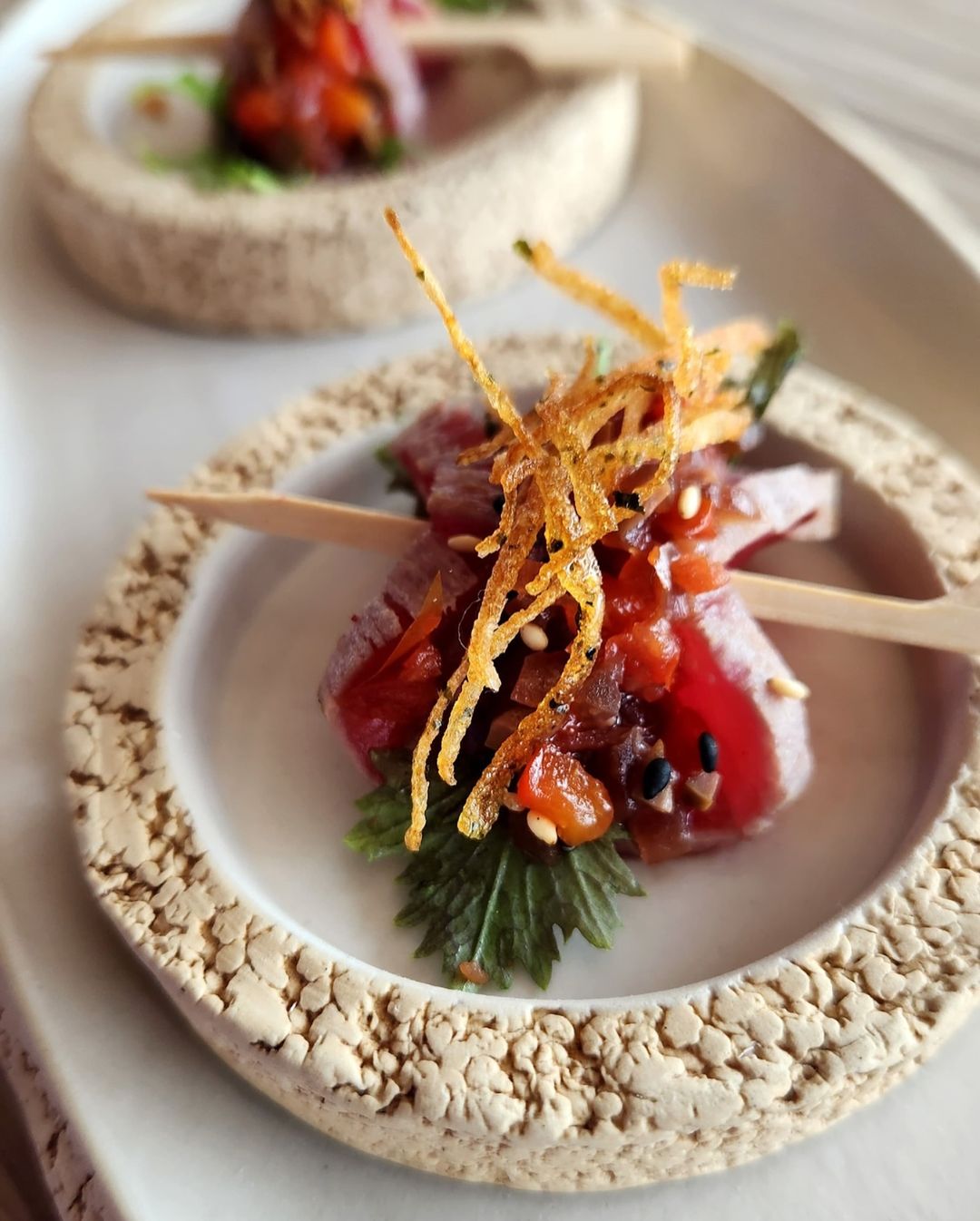 Bâoli Dubai — Mediterranean-Asian dishes in the night-lit dining room at J1 Beach