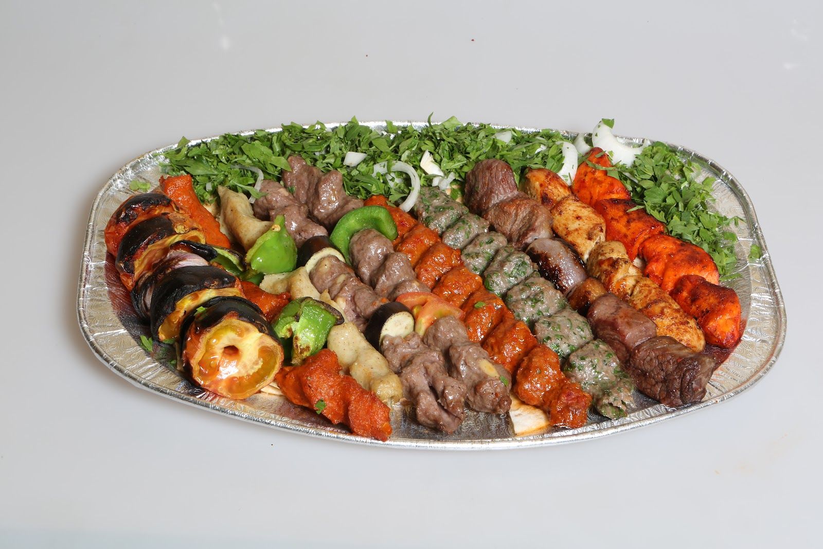 Beirut Express Satwa Dubai — shawarma saj wrap being pressed on the grill