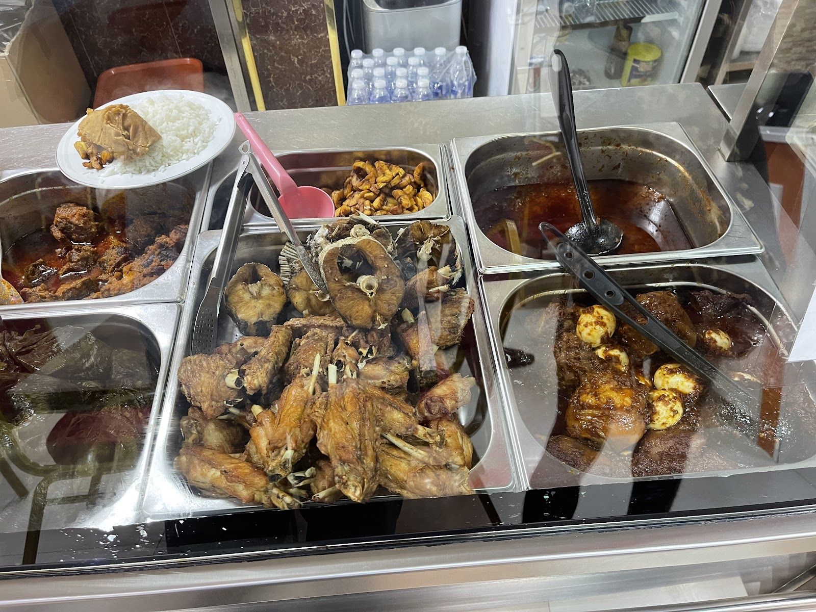 West African food dishes — jollof rice, egusi, suya