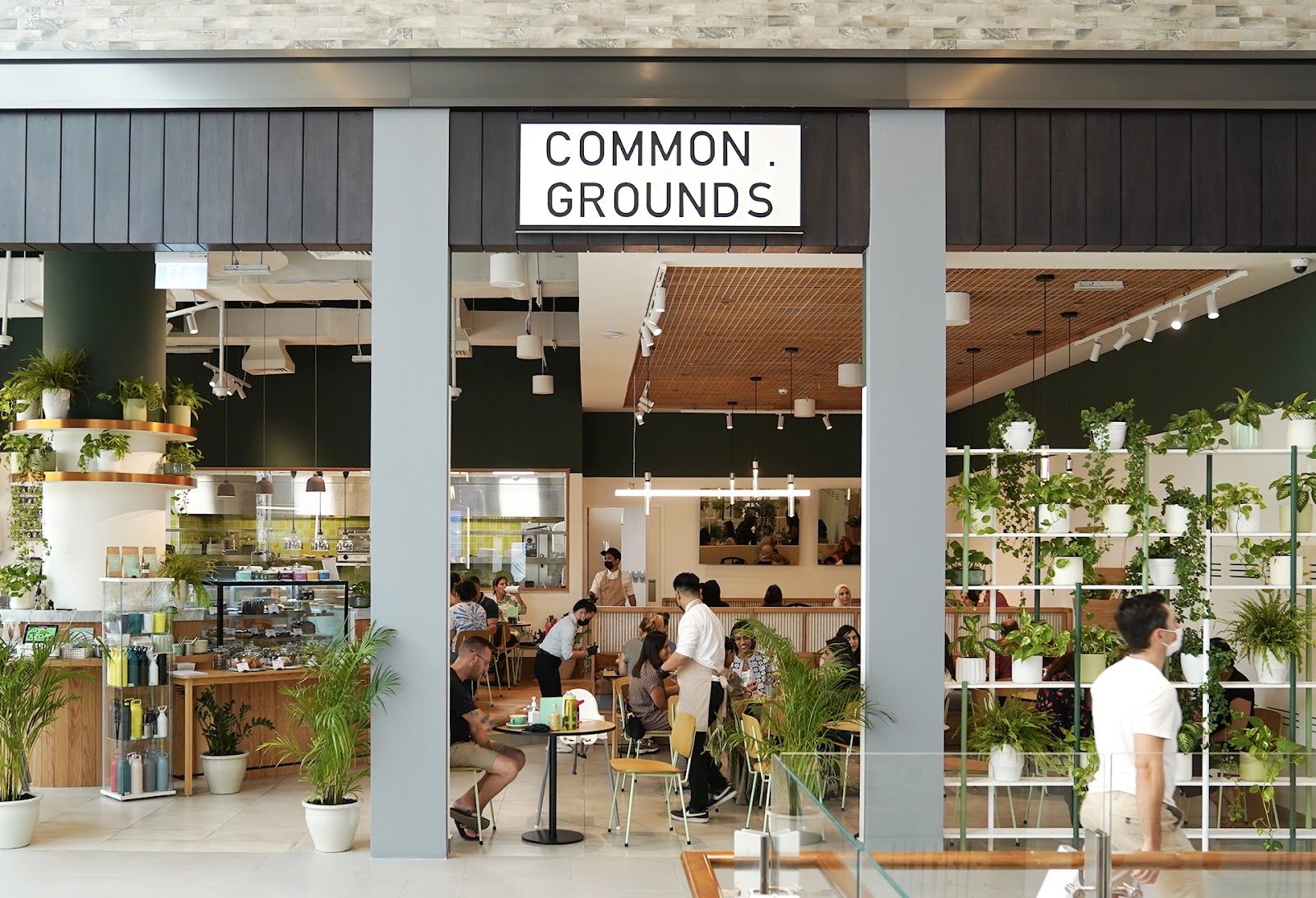 Common Grounds DIFC &mdash; specialty coffee bar with espresso machine and breakfast plates