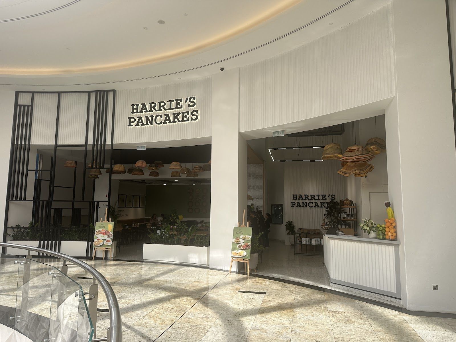 Harrie's Pancakes Dubai — tall stack of pancakes with toppings