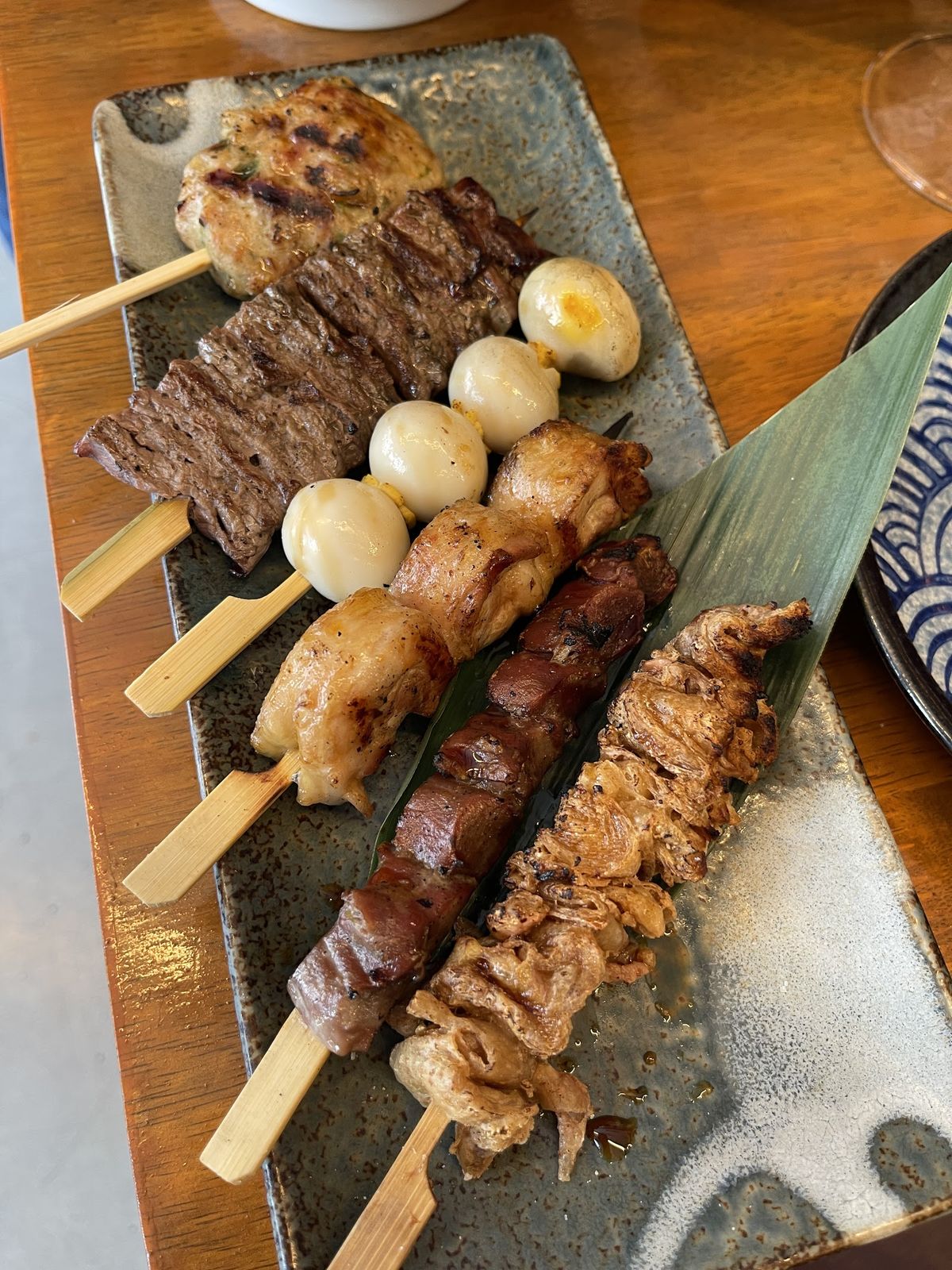 Izakaya-style Japanese dishes on wooden table