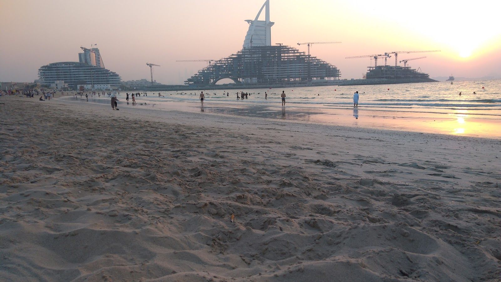 Beachfront restaurant tables evening setting JBR