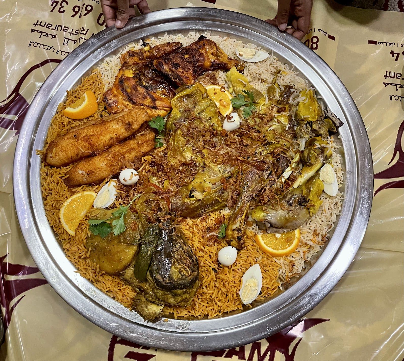 Abundant Yemeni feast spread with mandi, rice and salads