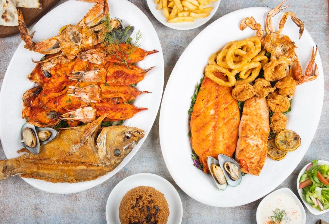 Fresh seafood platter grilled fish lemon Dubai restaurant