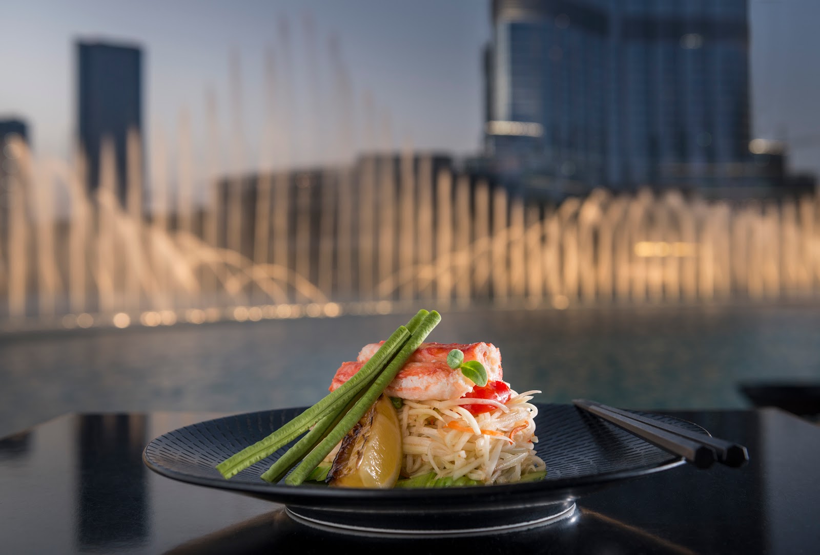 Thiptara Dubai — terrace tables over Burj Lake at Palace Downtown