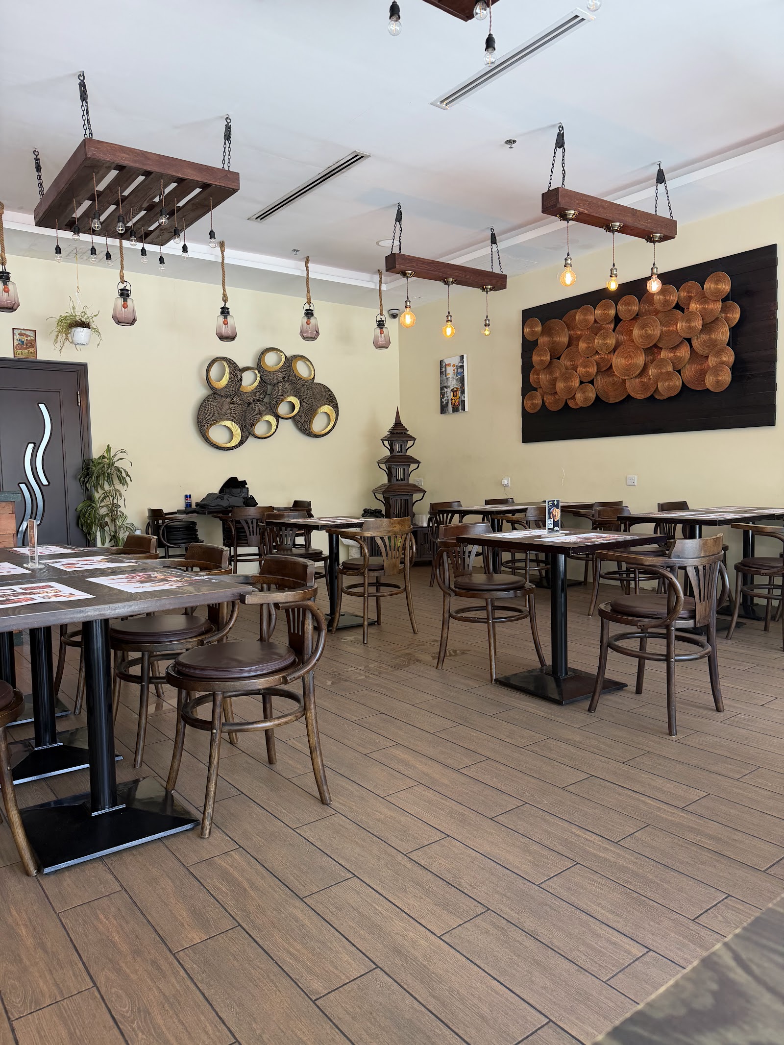 Tuk Tuk Thai Cuisine Sustainable City Dubai — pad kra pao and Thai dishes on the plaza strip