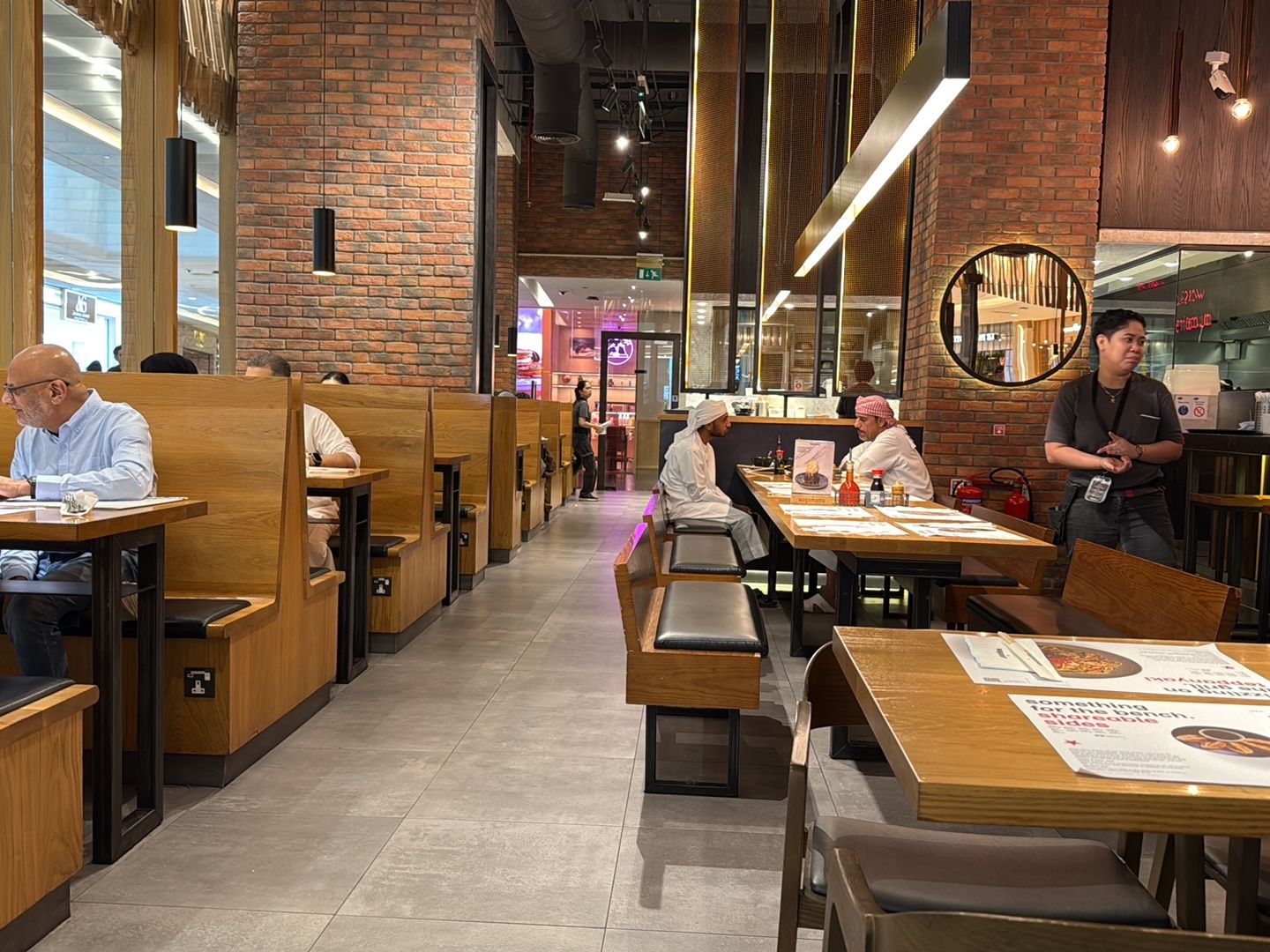 Wagamama Dubai — katsu curry and ramen bowls on long bench tables
