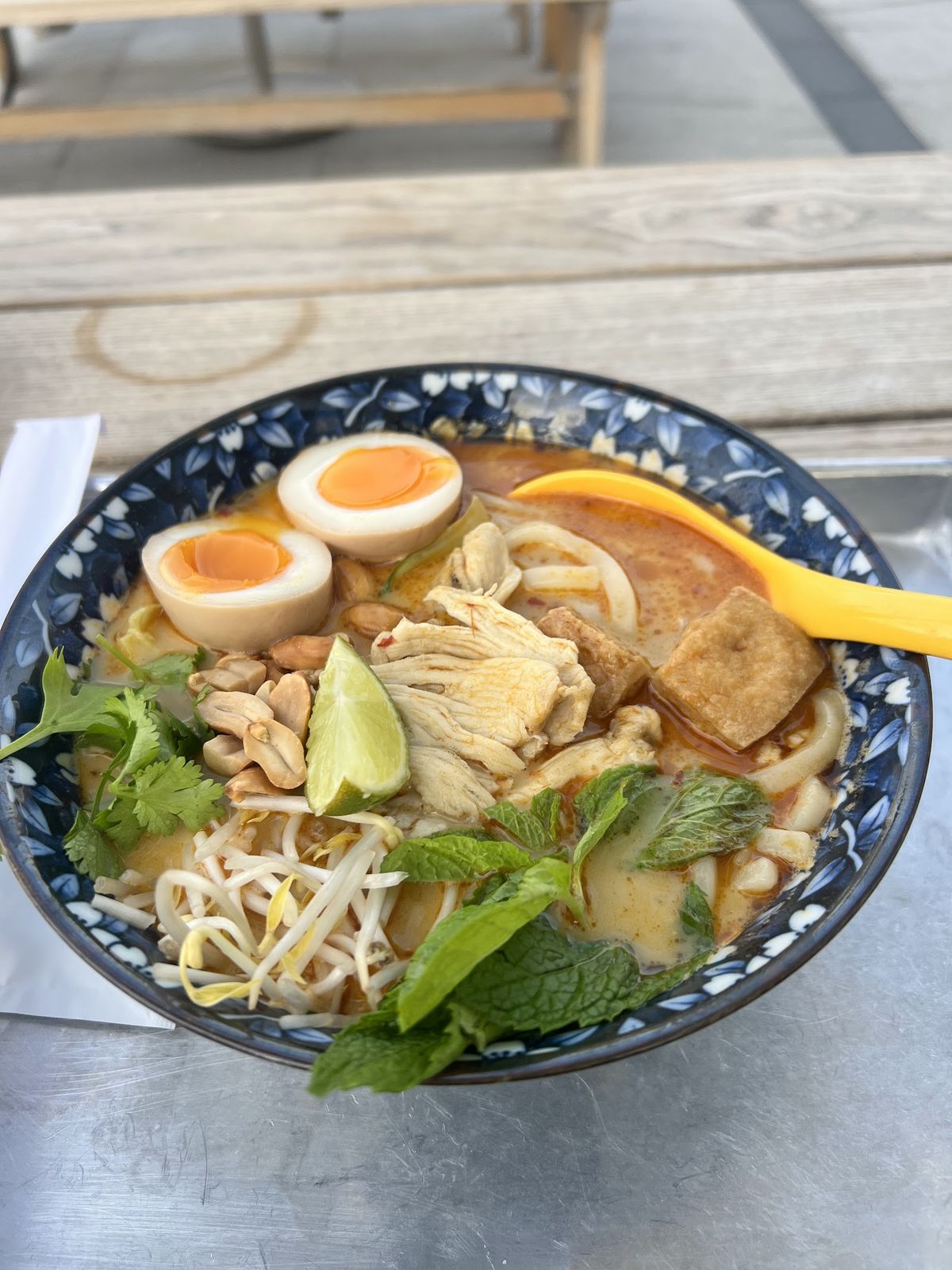 Wokyo Noodle Bar Dubai — flame-tossed wok noodles in a takeaway box